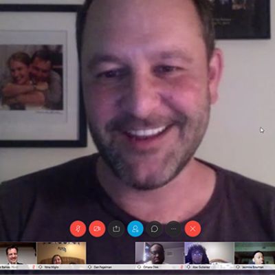 Dan is at his home with his wife picture hanging in the wall.